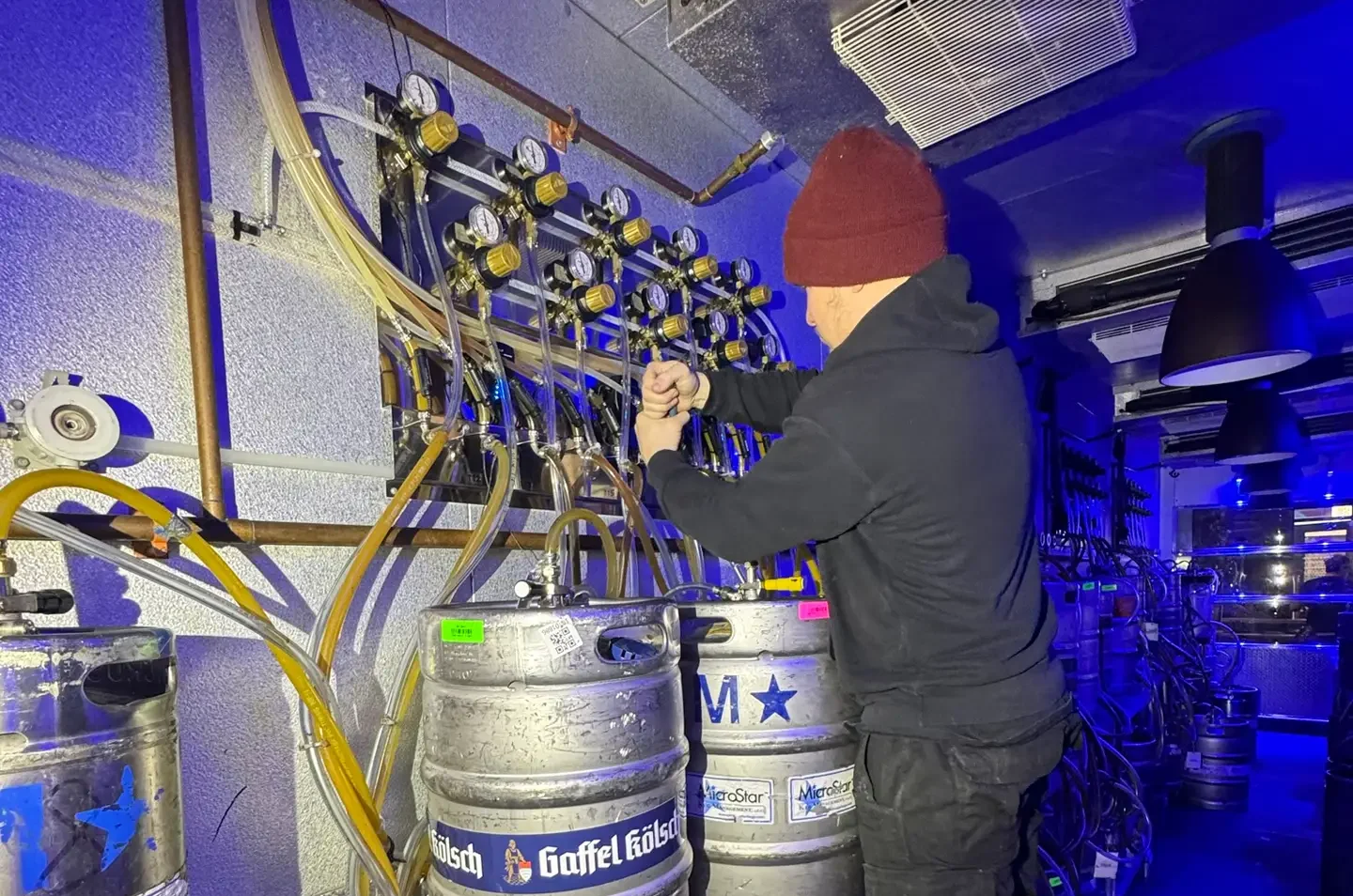 man cleaning beer liines