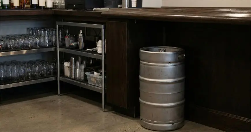 Half barrel keg stored under bar counter