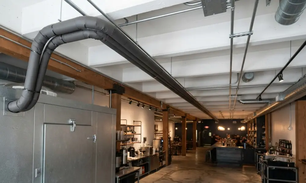 insulated python lines running from a walk-in cooler to a distant bar counter