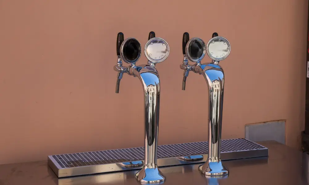 Two chrome beer tower dispensers