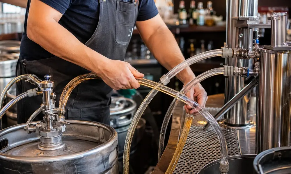 bartender cleaning a commercial draft beer line system