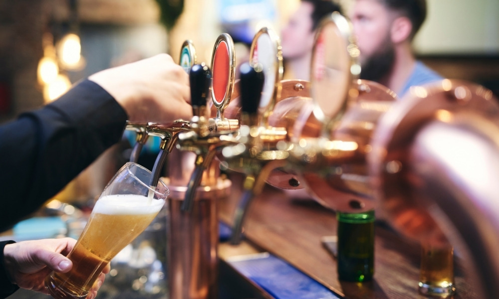 Bartender pouring draft beer